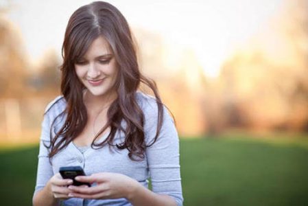 Young-Woman-Texting-On-Smartphone