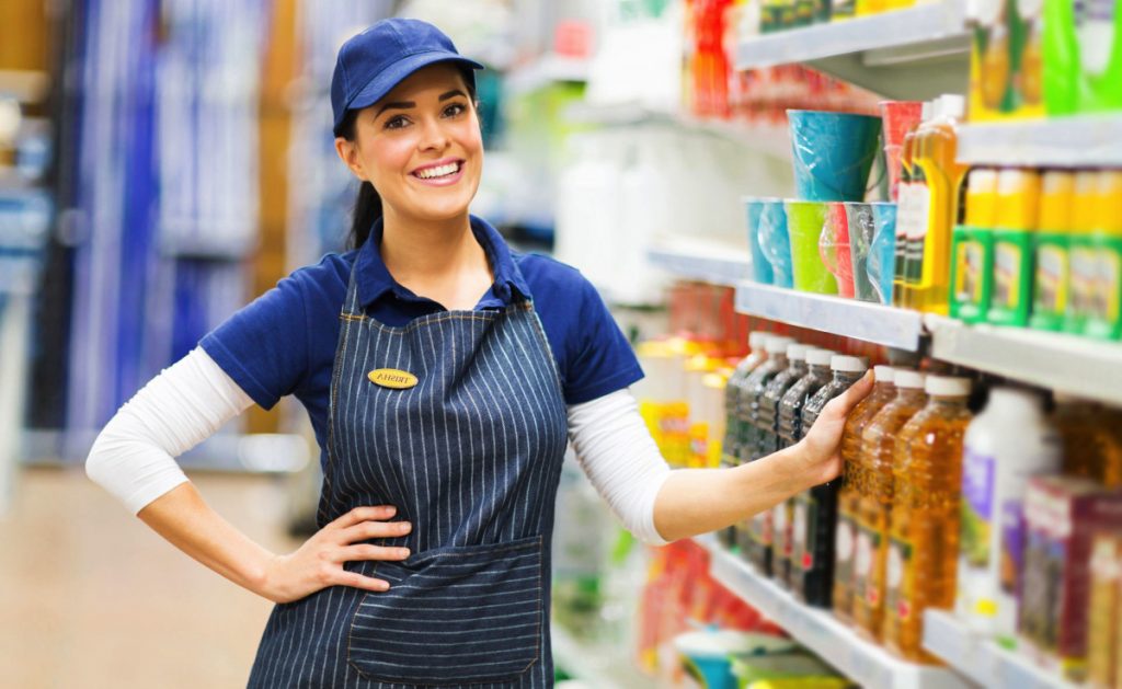 supermarket saleswoman standing in store